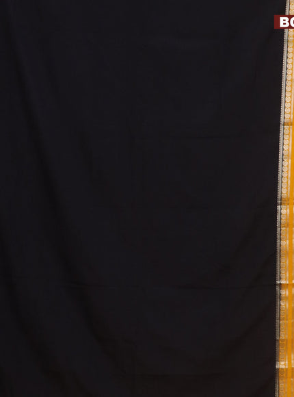 Semi crepe saree black and mango yellow with plain body and long rettapet zari woven border