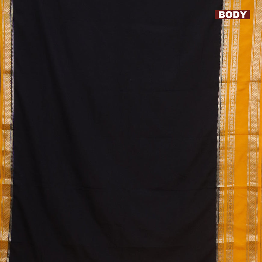 Semi crepe saree black and mango yellow with plain body and long rettapet zari woven border