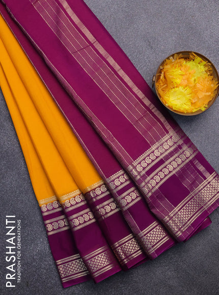 Semi crepe saree mango yellow and purple with plain body and long rettapet zari woven border