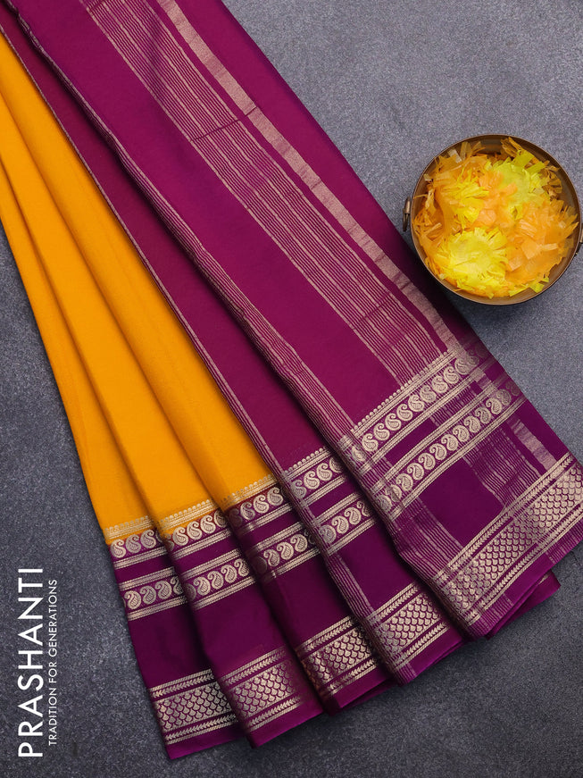 Semi crepe saree mango yellow and purple with plain body and long rettapet zari woven border