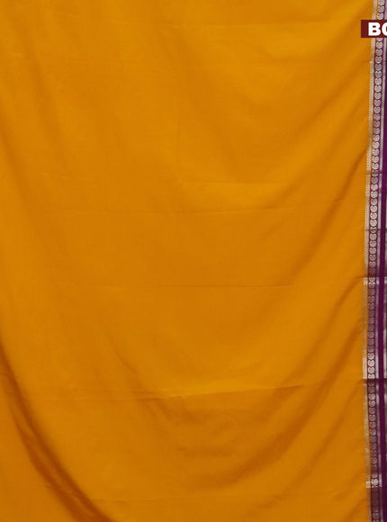 Semi crepe saree mango yellow and purple with plain body and long rettapet zari woven border