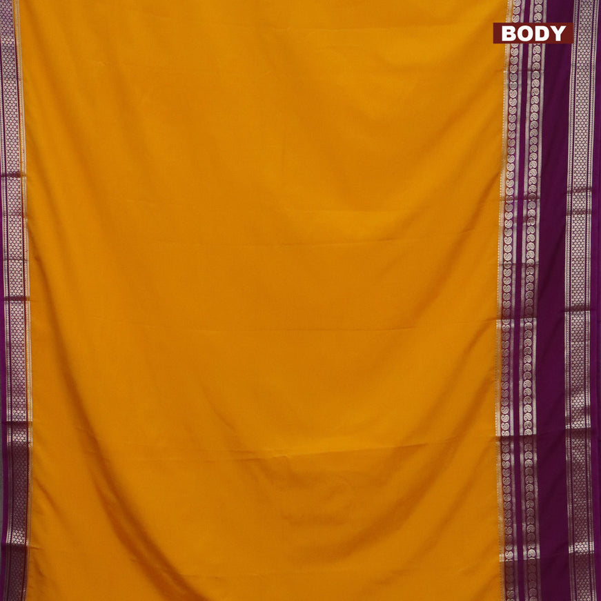 Semi crepe saree mango yellow and purple with plain body and long rettapet zari woven border