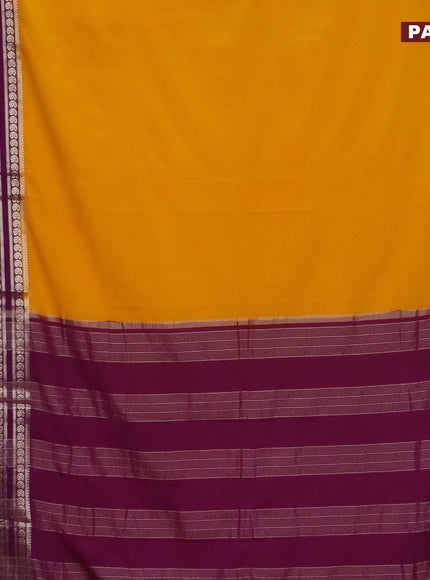 Semi crepe saree mango yellow and purple with plain body and long rettapet zari woven border