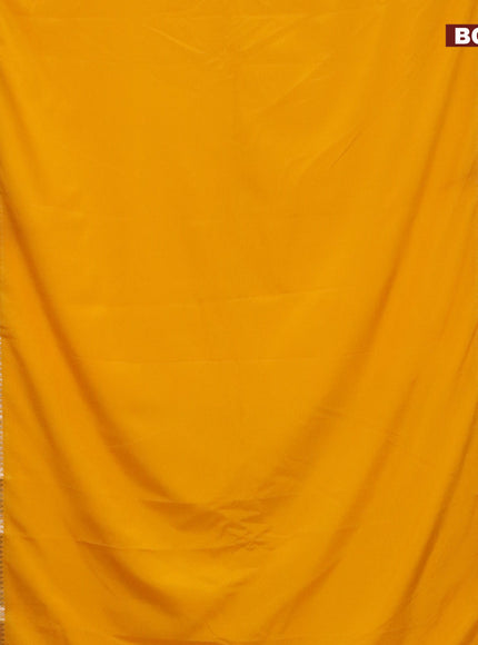 Semi crepe saree mango yellow and purple with plain body and rettapet zari woven border