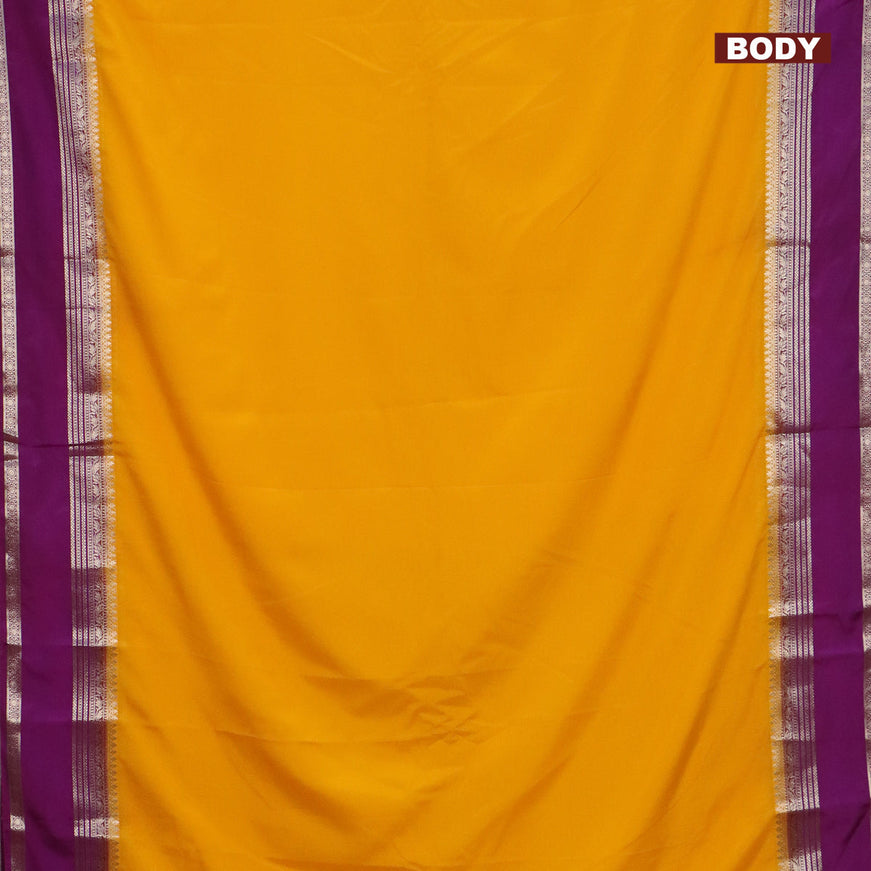 Semi crepe saree mango yellow and purple with plain body and rettapet zari woven border