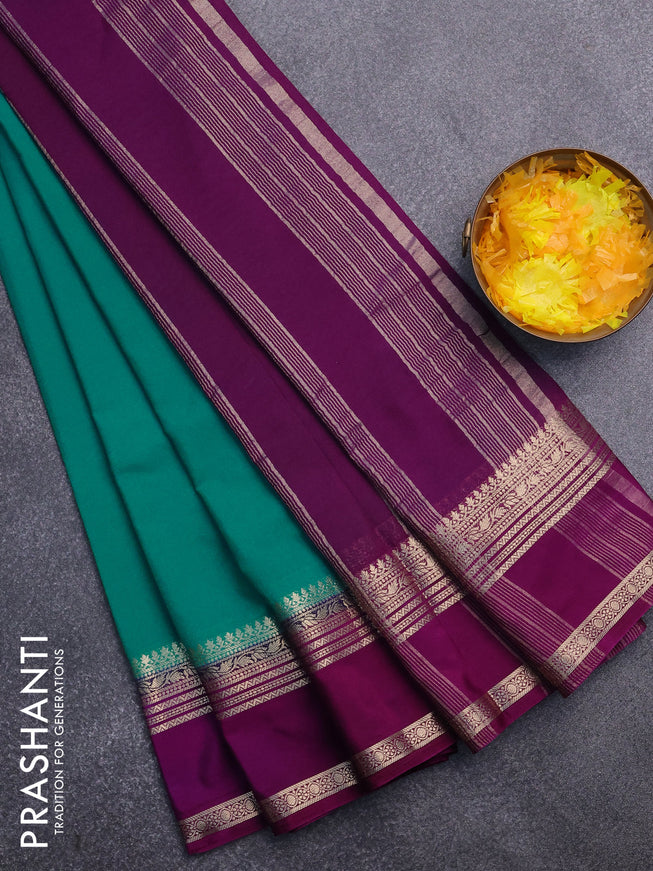 Semi crepe saree teal blue shade and purple with plain body and rettapet zari woven border