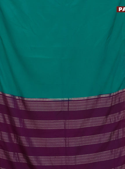 Semi crepe saree teal blue shade and purple with plain body and rettapet zari woven border