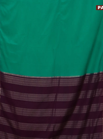 Semi crepe saree teal green and purple with plain body and rettapet zari woven border