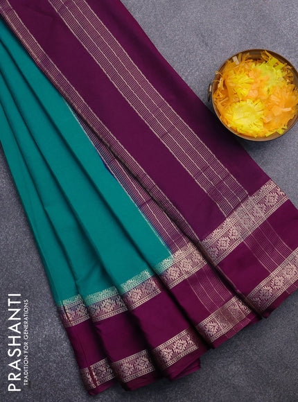 Semi crepe saree teal blue and purple with plain body and rettapet zari woven border