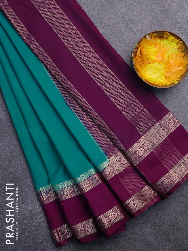 Semi crepe saree teal blue and purple with plain body and rettapet zari woven border