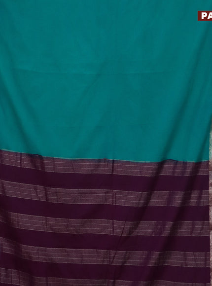 Semi crepe saree teal blue and purple with plain body and rettapet zari woven border