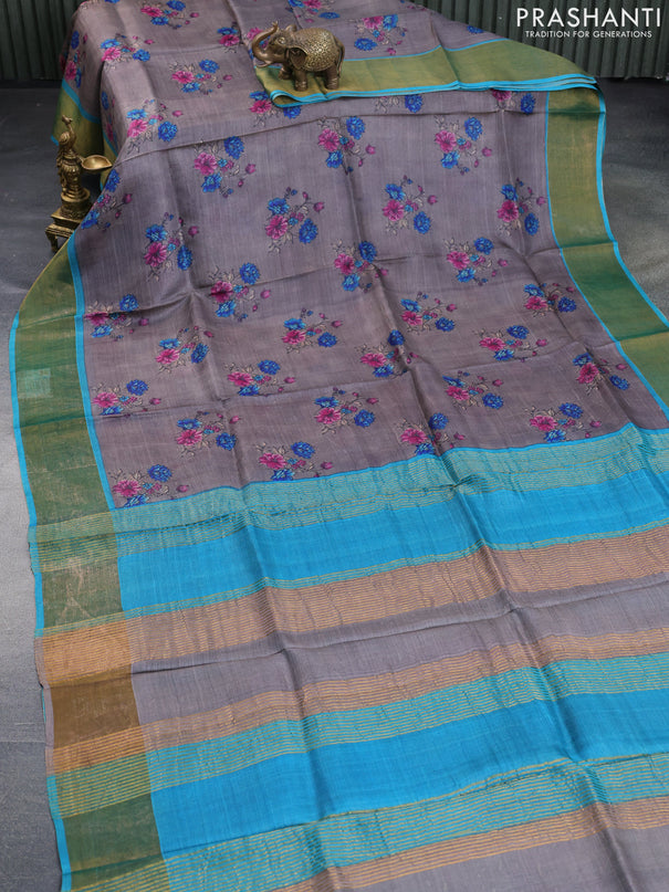 Pure tussar silk saree grey and cs blue with allover floral butta prints and zari woven border