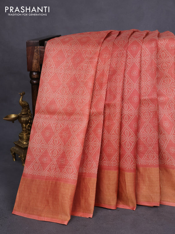 Pure tussar silk saree rustic orange with allover bandhani prints and zari woven border