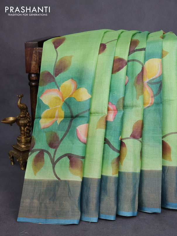 Pure tussar silk saree light green and peacock blue with allover floral hand painted prints and zari woven border