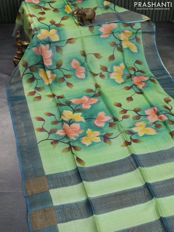 Pure tussar silk saree light green and peacock blue with allover floral hand painted prints and zari woven border