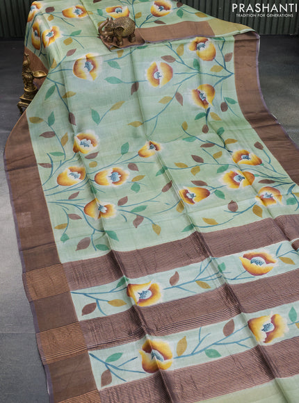 Pure tussar silk saree pastel green and dark grey with allover floral hand painted prints and zari woven border