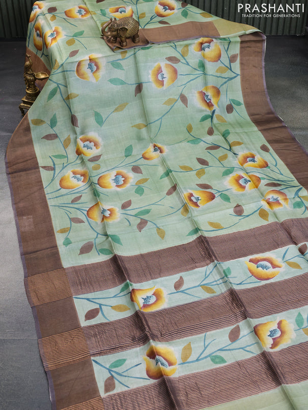 Pure tussar silk saree pastel green and dark grey with allover floral hand painted prints and zari woven border