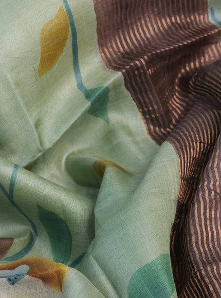 Pure tussar silk saree pastel green and dark grey with allover floral hand painted prints and zari woven border