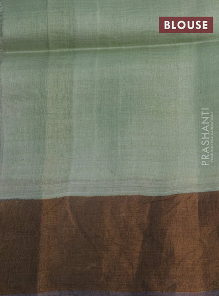 Pure tussar silk saree pastel green and dark grey with allover floral hand painted prints and zari woven border