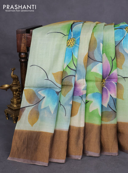 Pure tussar silk saree green shade and pastel brown with allover floral hand painted prints and zari woven border