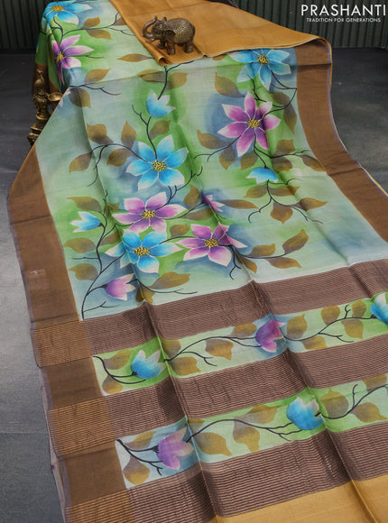 Pure tussar silk saree green shade and pastel brown with allover floral hand painted prints and zari woven border