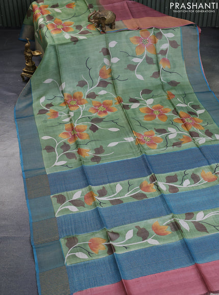 Pure tussar silk saree pastel green and peacock blue with allover floral hand painted prints and zari woven border