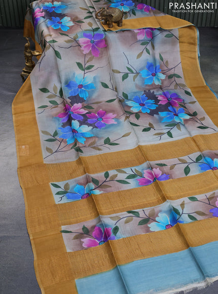 Pure tussar silk saree multi colour and mustard shade with allover floral hand painted prints and zari woven border