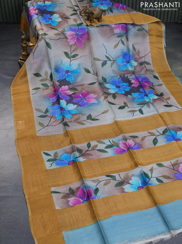 Pure tussar silk saree multi colour and mustard shade with allover floral hand painted prints and zari woven border