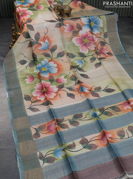 Pure tussar silk saree multi colour and pastel blue with allover floral hand painted prints and zari woven border