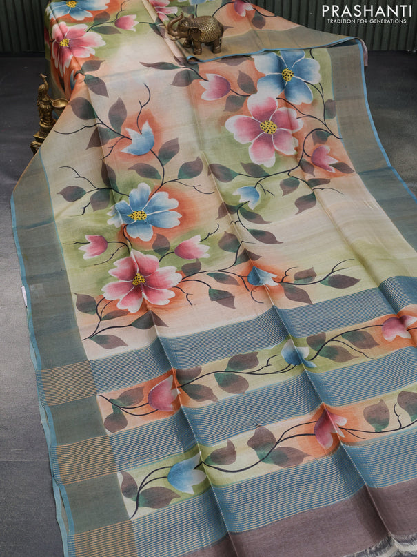 Pure tussar silk saree multi colour and pastel blue with allover floral hand painted prints and zari woven border