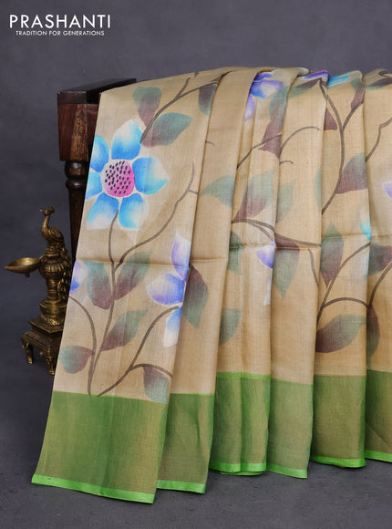 Pure tussar silk saree sandal and green with allover floral hand painted prints and zari woven border