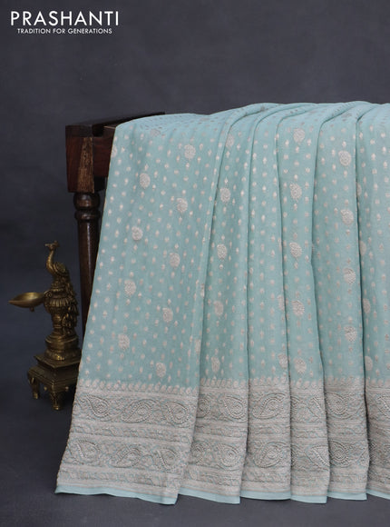 Banarasi georgette saree pastel blue shade with allover thread & zari weaves and woven border