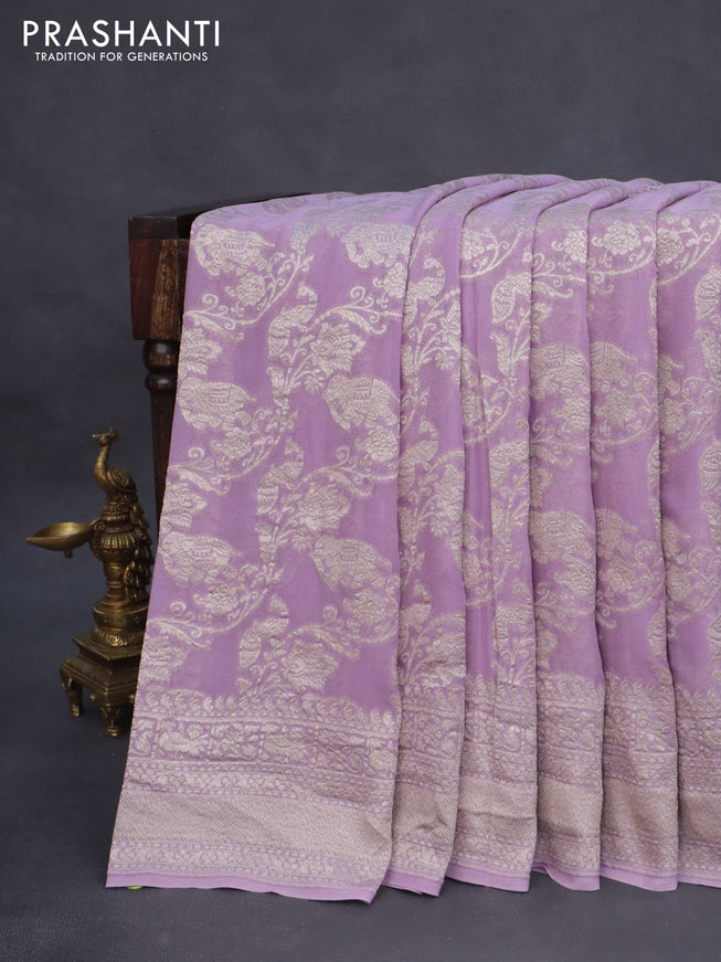 Banarasi georgette saree lavender shade with allover thread & zari weaves and woven border