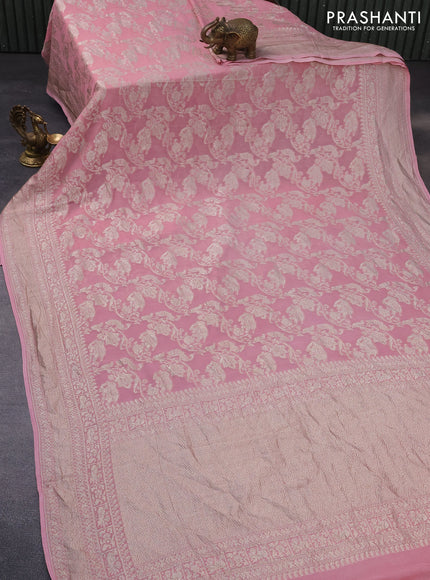 Banarasi georgette saree pink shade with allover thread & zari weaves and woven border