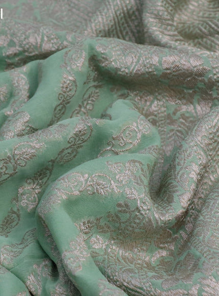 Banarasi georgette saree pastel green with allover thread & zari weaves and woven border