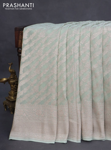 Banarasi georgette saree pastel green with allover thread & zari weaves and woven border