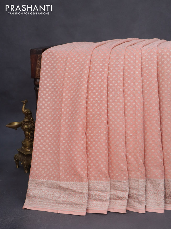 Banarasi georgette saree peach shade with allover thread & zari weaves and woven border