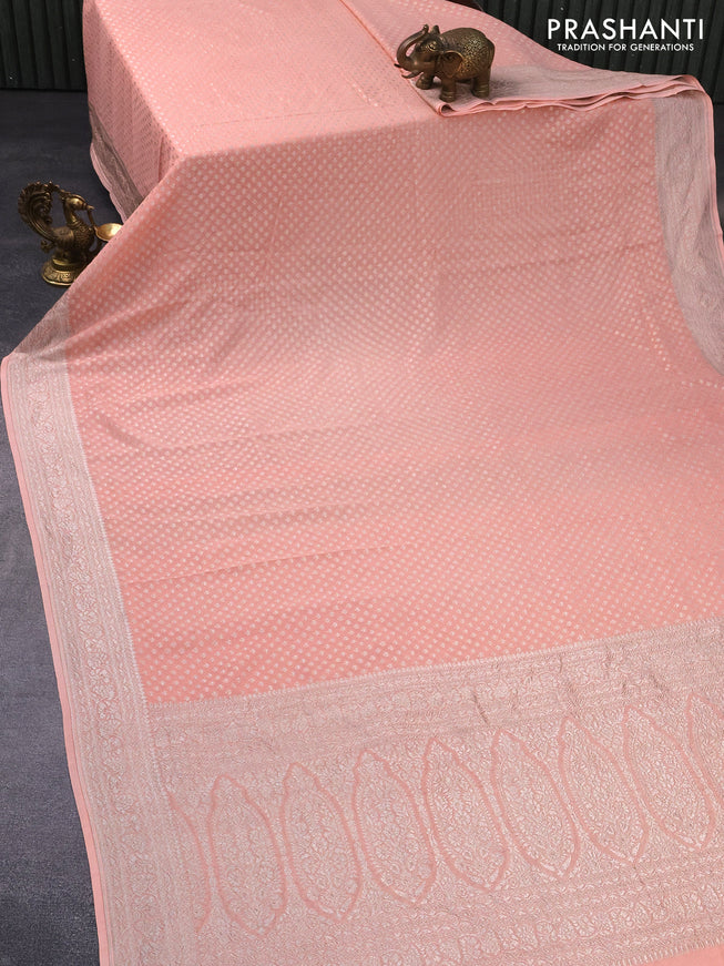 Banarasi georgette saree peach shade with allover thread & zari weaves and woven border