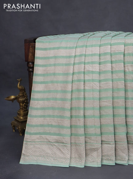 Banarasi georgette saree pastel green with allover thread & zari weaves and woven border