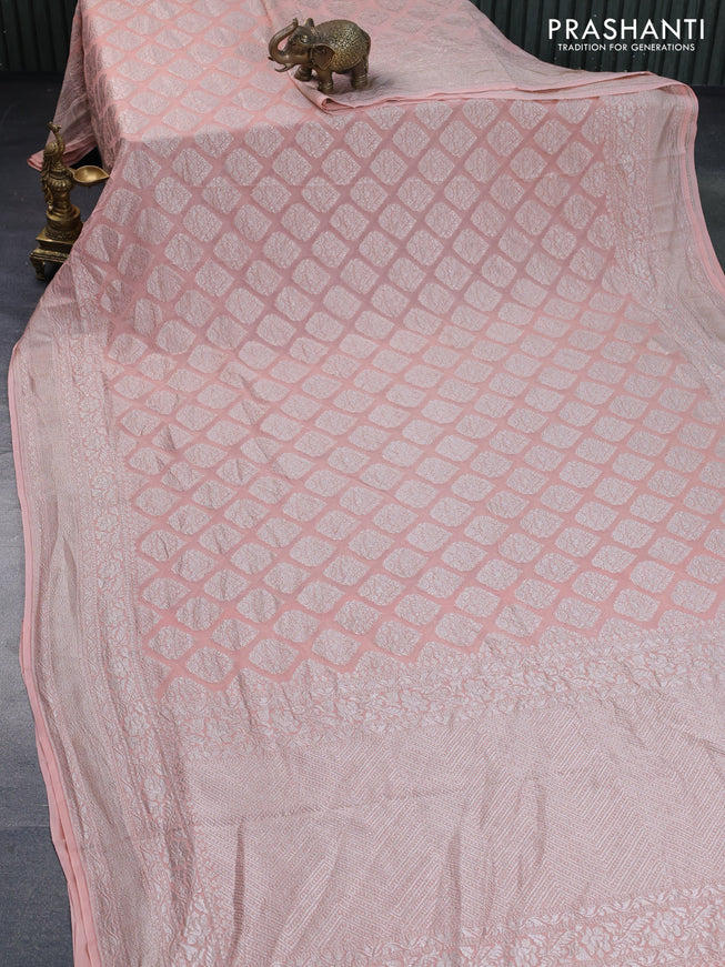 Banarasi georgette saree pastel peach orange with allover thread & zari woven butta weaves and woven border