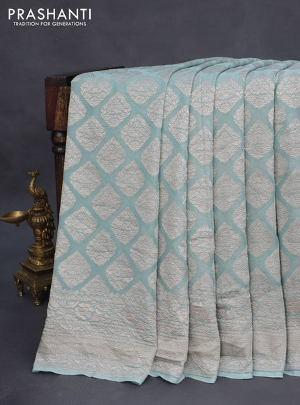 Banarasi georgette saree pastel blue shade with allover thread & zari woven butta weaves and woven border