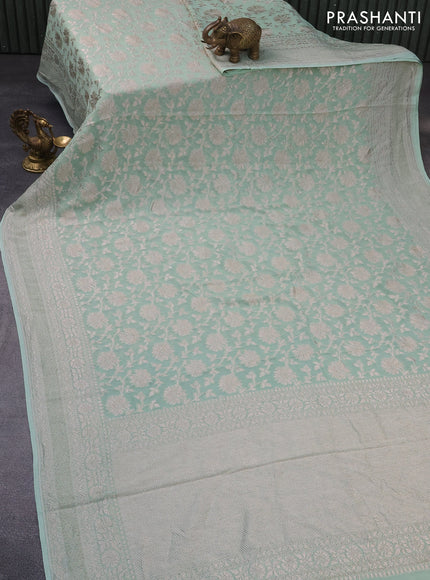 Banarasi georgette saree pastel green shade with allover thread & zari weaves and woven border