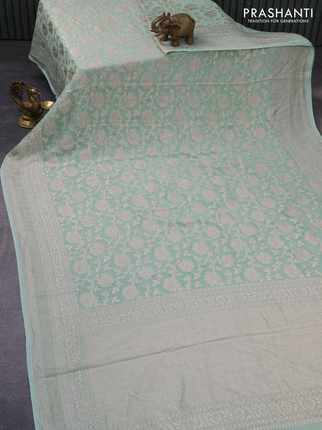 Banarasi georgette saree pastel green shade with allover thread & zari weaves and woven border