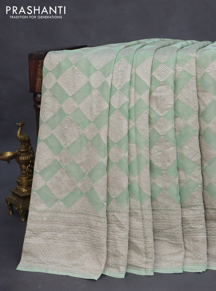 Banarasi georgette saree pastel green with allover thread & zari woven geometric weaves and woven border