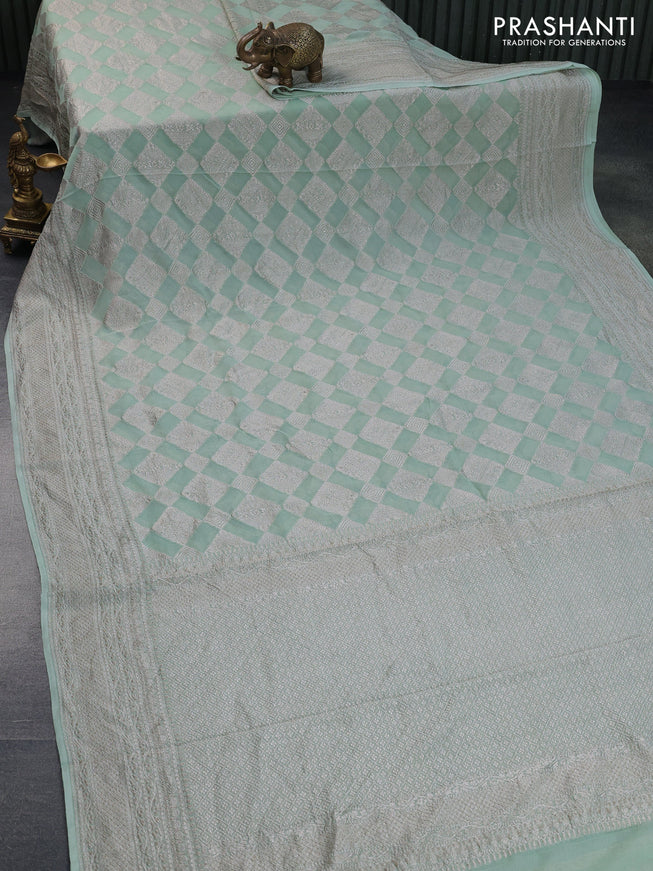 Banarasi georgette saree pastel green with allover thread & zari woven geometric weaves and woven border