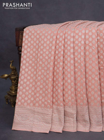 Banarasi georgette saree peach shade with allover thread & zari woven butta wevaes and woven border