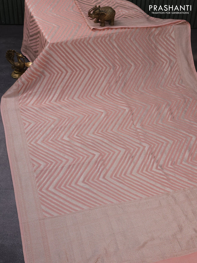 Banarasi georgette saree peach shade with allover thread & zari woven zig zag weaves and woven border