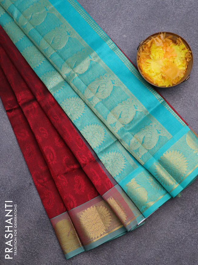 Silk cotton saree maroon and teal blue with allover self emboss & jacquard and rudhraksha & annam zari woven border