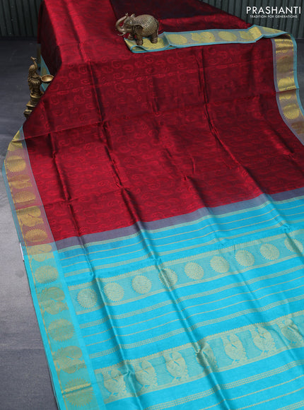 Silk cotton saree maroon and teal blue with allover self emboss & jacquard and rudhraksha & annam zari woven border