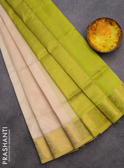 Silk cotton saree cream and light green with allover self emboss & jacquard and rich zari woven border